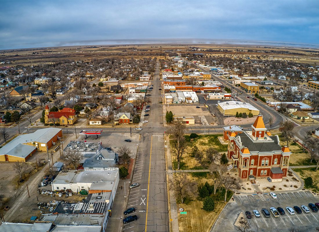 Las Animas, CO - Aerial View of Buildings and Homes in Las Animas Colorado During the Late Fall with a Cloudy Sky